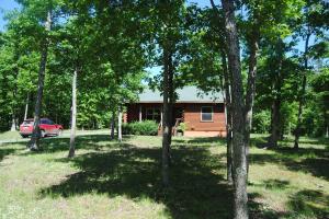 A BEAUTIFUL CEDAR LOG HOME, 6'' SOLID CEDAR WALLS, EXTRA CELLO IN CEILING, ALL FURNISHED, DOWN TO WASHER DRYER, FREEZER, DISHES, COFFE POT, MICRWAVE, IN A PRIVATE SETTING, OAK CABINETS, ANTENNA FOR TV GET SEVERAL CHANNELS, DEER AND WILDLIFE EVERY WHERE, TONGUE AND GROOVE CEILING, A CREEK IS RIGHT BELOW THE PROPERTY LINE, RV/SHOP STORAGE, PEACE AND QUIET IS WHAT YOU WILL FIND OUT HERE,