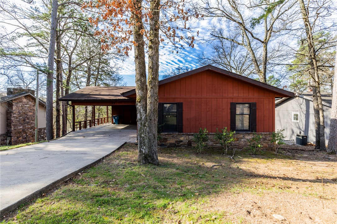 Located on the peaceful shores of Lake Rayburn in Bella Vista, this true lakefront home at 17 Devizis Dr offers an excellent opportunity to enjoy lake living at an affordable price point. The property includes a private dock with direct access to this desirable no-wake lake—ideal for kayaking, fishing, and relaxing on the water.

Inside, the home features vaulted ceilings, exposed beams, and a floor-to-ceiling rock fireplace, offering a classic, retro style with plenty of character. The layout is functional, with a kitchen that includes a peninsula for everyday use.

The seller is offering a $25,000 allowance, providing flexibility for updates and improvements to suit your personal style. Use the money to update the things you would like to update like new flooring or paint...

Whether you’re looking for a weekend retreat, investment property, or a full-time residence, this property presents a great opportunity to own lakefront in Bella Vista.
