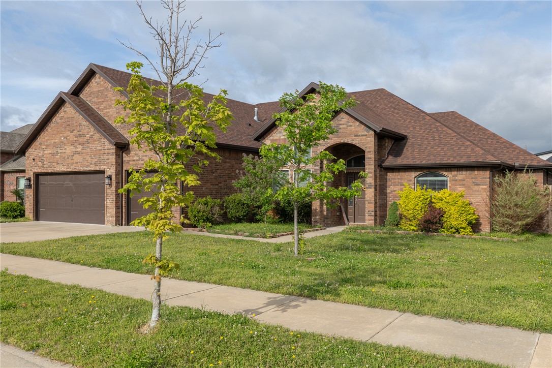Beautiful Legacy Point home has a lot to offer. With 4 bedrooms (3 on main floor), 3.5 bathrooms and an office, this is a perfect family home or investment for your student. Located in West Fayetteville with easy access to i49 and 10 minutes to campus. The living room has ceramic "wood floor" tile, corner fireplace, vaulted ceiling and opens to the dining room. A functional kitchen with  granite, stainless appliances, gas cooktop with real vent hood and an eat in kitchen. The split floor plan has the primary suite with a huge soaker tub, walk-in closet and shower and ample natural light. The 2nd & 3rd bedrooms are on the other side and share a Jack and Jill bathroom. A 4th bedroom is upstairs and has its own bathroom. The back yard is fully fenced and has a lovely covered outdoor entertainment area with a fireplace and room to hang your TVfor gameday.