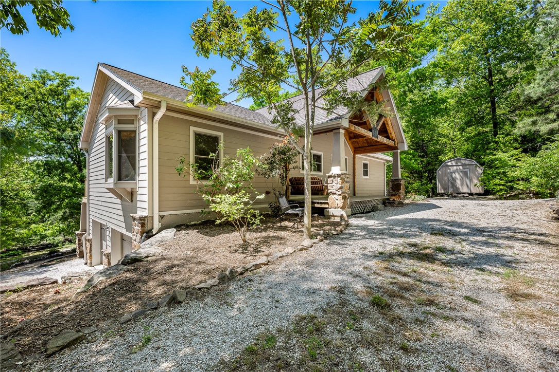 If you're looking for a little piece of Heaven out on the mountain, we've got one that fits the bill!  This beautiful custom built post & beam home, located at the end of the road on 5.9 mostly wooded acres, offers privacy & so much more.  Structural insulated panels & insulated concrete form construction give greater structural integrity & improved energy efficiency, which means lower bills & better comfort.  The open living area offers large windows looking out at the trees & nature.  The kitchen features custom cherry cabinets & an island complete with a prep sink!  The primary bedroom has a walk-in closet, en suite with double sinks & a deck to sit & enjoy your morning coffee.  There's an office space, primary bedroom & bath on the main level.  The guest bedroom/music room & private bath are downstairs.  There's also a walk out basement to enjoy the deer & wildlife that appear.  A diversion drainage ditch at the top of the hill diverts all water from the top around the house itself.  This is a rare opportunity!