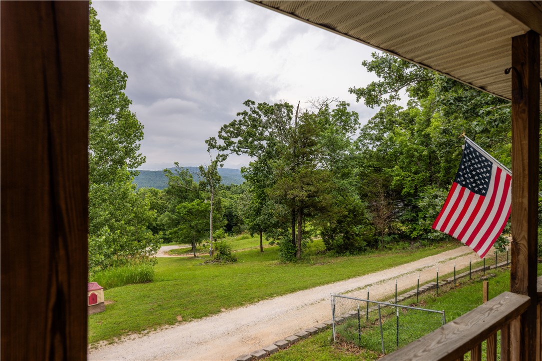 Spacious country living just minutes from NWA and the River Valley! Situated on 5 beautiful acres this exceptional property offers the perfect blend of convenience, comfort, and functionality. Inside you’ll find beautiful updated finishes, generous living spaces, and a thoughtful floor plan. The home features over 3,000 sqft of living space with 5 bedrooms, office, and 2.5 bathrooms. Enjoy peaceful mornings on the front porch and relaxing evenings on the cozy back patio. A standout feature is the impressive 3,000+ sq ft metal shop complete with four overhead doors and a heated and cooled office already plumbed for a future bathroom . Whether you’re running a business, storing equipment, pursuing hobbies, or simply need extra space, this shop offers endless possibilities. Properties offering this combination of acreage, location, updated living space, and a large functional shop are hard to find. Enjoy the privacy of country living with quick access to schools, shopping, and the I-49 corridor
