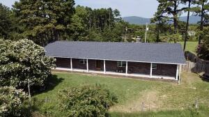 Perched high above beautiful Lake Ludwig with panoramic views of the water & river valley this well built home is certainly a rare find.  Encompassed by large shade trees creating a private oasis yet minutes from town & the Ozark National Forest.  A large front covered porch adds valuable outdoor space which faces the Lake. The 7.4 acre lot is partially wooded yet offers a garden area & livestock holding pen.  The home has newer floor coverings, abundant storage, & bonus office area.   New roof (2021)!  New HVAC (2014)!  Aux exterior wood heat system!  Fenced yard!  Brick fireplace!  *Priced according.  Add your signature upgrades and make this diamond shine!!!