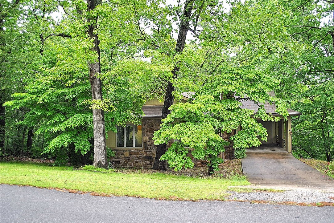 Priced well below appraisal. Nice 3 bedroom, 3 bath home with 2 levels and 2,068 sq.ft. Roof new in 2014, Exterior paint 2013, heat pump new 2018, many other updates have been completed. Granite kitchen counters, S.S. sink, S.S. appliances. Wood burning fireplace in living room. Main level has 2 bedrooms and 2 bathrooms, laundry, living and kitchen. Inside stairs lead to the lower level walk-out with family room, bedroom and full bathroom. Carport has storage as well as storage under the carport. Lots of shade trees and easy care yard. A real deal at this fantastic price. Call for a showing today!