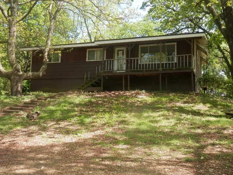 Great Location! Home in the country but only minutes to the city limits of Berryville. 3 bedroom, 1 bath, some new appliances, unfinished basement, 3.96 wooded acres that provide partial seclusion, large fenced back yard, small outbuilding. This is a Homesteps Freddie Mac property.
