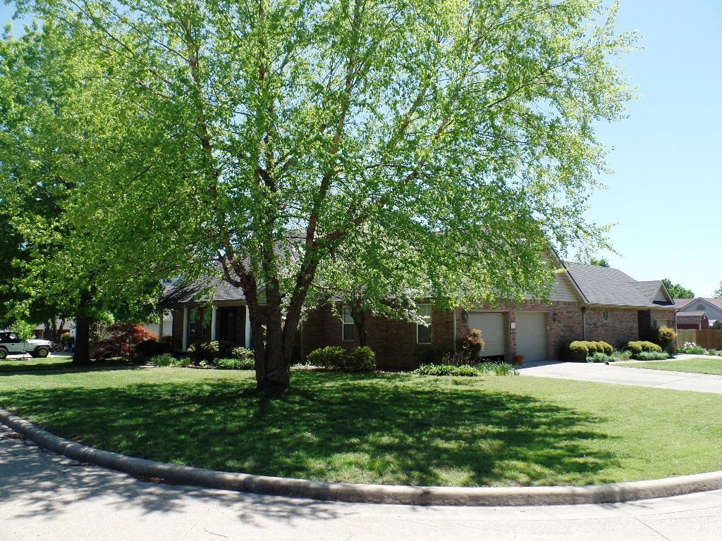 Great corner lot! Very nice well built all brick home. Kitchen features corian countertops & sinks, lots of cabinets and extra storage. Lots of living space, master bedroom features trey ceiling, and master bath has dual vanities, whirlpool and walk-in shower. Bonus room upstairs approx 566 sf.  Large laundry room with extra storage. Amazing covered deck overlooking privacy fenced back yard. Oversized 2 car garage and 3rd garage that has a skylight and separate power box installed for emerg. generator.