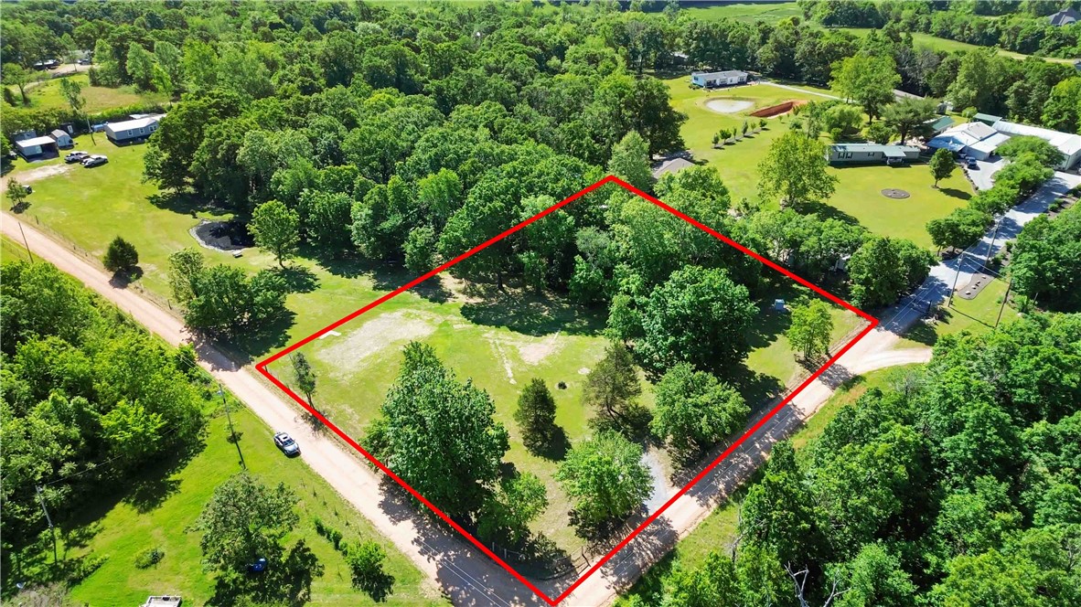 This beautiful 2-acre lot is ready for your new home! Featuring mostly flat terrain with mature trees, the property offers a perfect balance of privacy and usability. This lot is ready for your new home! Enjoy 2 acres of mostly flat terrain with mature trees on the property, cleared enough for you to build a home or bring a manufactured home. Water tap and well house on property. Electric available. Fully landscaped and a driveway set up. Escape the chaos of city life in this tucked away parcel in Decatur.