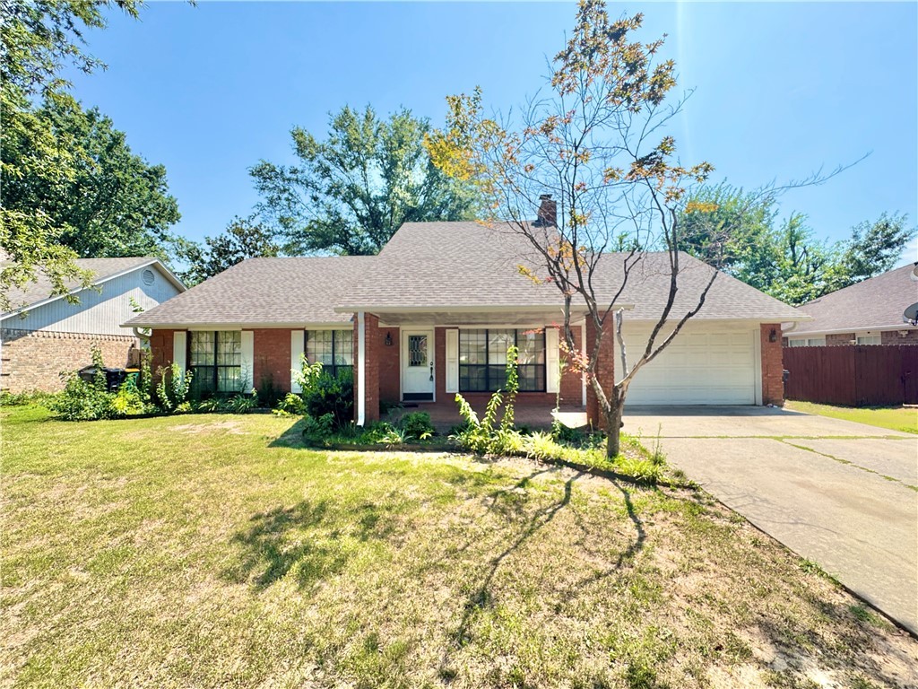 Charming brick home in a quiet, established Rogers neighborhood—minutes to everything. Inside, enjoy faux-wood floors in the living room, plush carpeted bedrooms, vaulted ceiling and cozy fireplace with custom built-ins. Ceiling fans and blinds throughout. Relax on the covered front porch or the screened back patio overlooking a fenced yard shaded by mature trees. Enclosed 2-car garage. Prime location with quick access to I-49, the Pinnacle Hills Promenade, and Malco Pinnacle Hills Cinema for shopping, dining, and movies. Love the outdoors? Hop on the Razorback Regional Greenway to explore miles of connected trails, parks, and nearby downtown Rogers. Close to Rogers schools, including Reagan Elementary, Oakdale Middle, and Rogers Heritage High. This inviting home blends comfort and convenience—schedule your tour today!