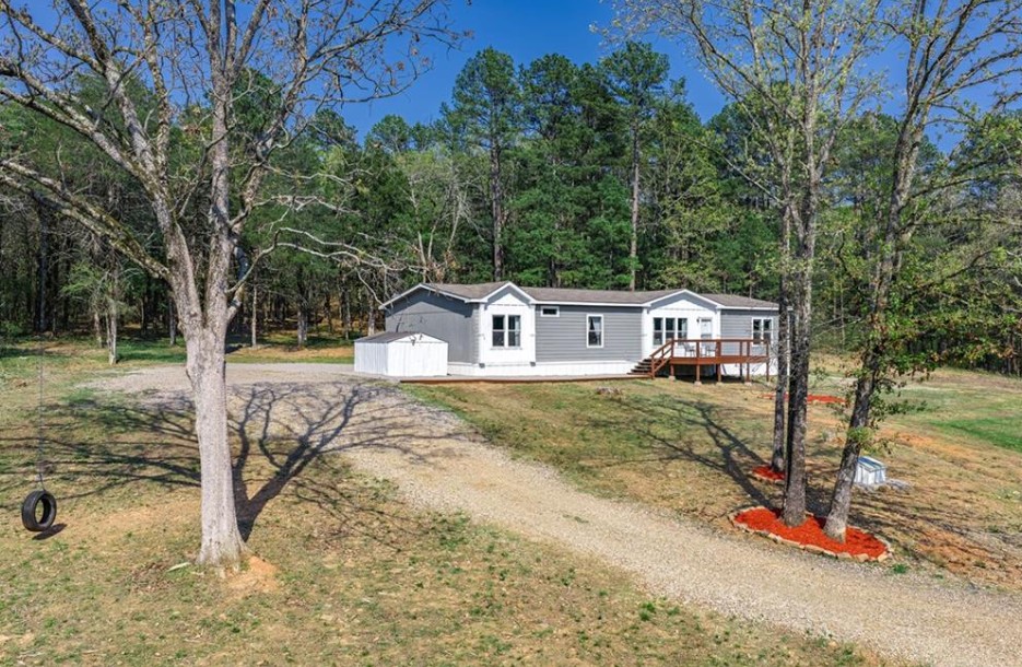 Take the scenic route to your new home on 5.11+- acres featuring a beautiful, peaceful creek. Relax creekside and enjoy a small pond/waterfall near the road. With land on both sides of the creek, the property offers endless possibilities beyond a private retreat, such as an Airbnb or RV parking across the creek. There is currently 1 RV spot in front of the home and a kennel on site. This 4-bedroom, 3-bath home includes updates like granite countertops, luxury vinyl plank flooring, drywall with crown moulding, and fresh interior and exterior paint. Two modern fireplaces enhance the living room and primary suite. Outdoor upgrades include rebuilt and repainted decks, pebble walkways, mulch, and perimeter accents. Major systems have been maintained, with HVAC serviced in 2025 and septic in 2026. The kennel includes heating, cooling, electricity, wash grates, and a removable divider. Ideal for country living, income potential, or future growth, no restrictive covenants or HOA, and high-speed fiber internet available.