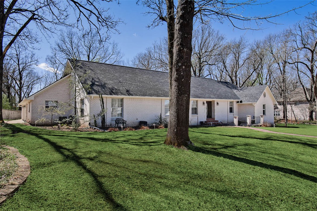 Welcome to this beautiful well-maintained home that blends comfort, style and functionality.  The spacious living areas are thoughtfully designed for both everyday living and entertaining.  The remodeled eat-in kitchen features a large island, walk-in pantry and ample space for gathering with family and friends.  Retreat to the primary suite offering a walk-in closet, his and her bathroom areas and an adjacent sitting room.  All additional bedrooms have attached bathrooms and walk-in closets.  An office with built-in shelves, a mudroom/laundry room, walk-out storage under the home and a rear garage door opening to a golf cart storage area are additional features that make this home so unique.  Located in a highly desirable community combined with close proximity to Razorback Greenway, Lake Fayetteville and Springdale Country Club.