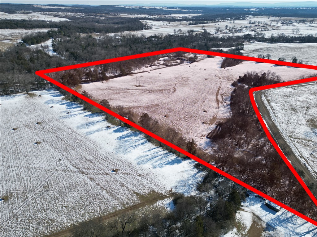 31.50 acres with County Road 3151 along the west boundary and Horsehead Creek running along the east side. The property offers usable ground suitable for a home, barn, arena, pasture for horses or livestock, and small hay production. Ample road frontage allows flexibility for driveway placement and barn access. No immediate neighboring residences provide open space and separation. The creek forms a natural boundary along the east side and adds privacy. Located just 7 minutes from Interstate I-40 access, this property offers convenient travel while maintaining a quiet rural setting. Suitable for residential, agricultural, or recreational use.