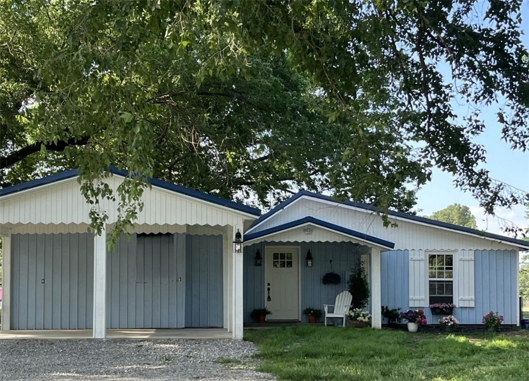 Modern Farmhouse on 1.3 acres, with mature trees, close to park and schools.  This fully renovated historic farmhouse with all new construction has large shed or work/machine shop with 1 car garage.  Featuring 3 bedrooms, 2 bathrooms, approximately 1300 sq ft, large kitchen and separate dining area, a spacious utility/mudroom with closets and cabinets.  Ample storage/bonus room above the 2-car carport, storm shelter, wired with plugs and lights for extra peace of mind. New interior and exterior paint, new HVAC, water-heater, appliances and exterior siding.  New flooring, carpet, lighting, cabinets with Corian countertops, and all new bathroom fixtures and appliances. The property also offers additional development potential with city-approved ability to split additional lots, and electric boxes already in place for two additional homesites; Buyer to verify all lot split and development opportunities with the city.