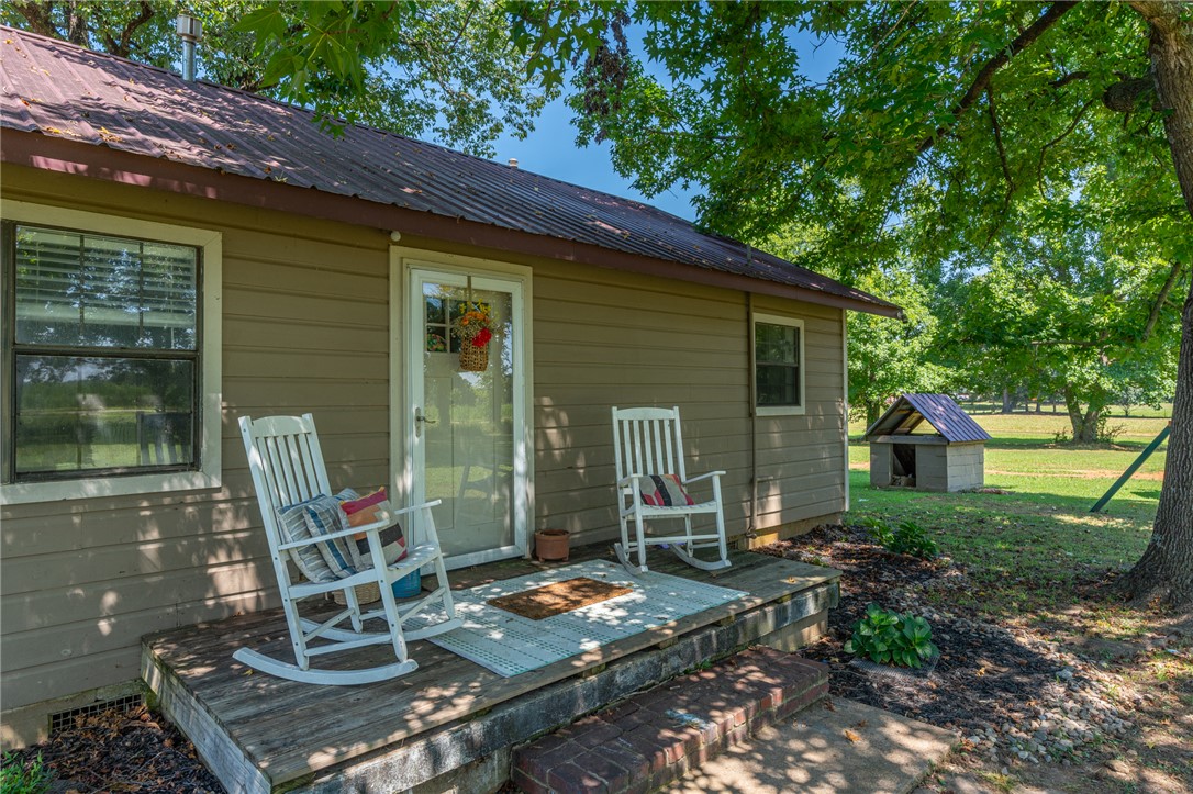 Escape to the country without giving up the convenience of being close to town! Nestled on 3.79 acres, this charming 3-bedroom, 1-bath updated farmhouse offers the perfect blend of comfort and country living. Whether you’re searching for your first home, looking to simplify with a smaller home, or wanting to expand your investment portfolio, this property is full of potential. Recent improvements include a brand-new septic system and a hot water heater that’s less than a year old, while the metal roof offers long-lasting durability. Outside, you’ll appreciate the carport, storage building, and nearly four acres of usable land with endless possibilities. There’s plenty of room for a garden, chickens, hobby farm animals, or simply enjoying the peaceful rural setting. If you’ve been dreaming of a little extra space and a slower pace of life, this property is ready to welcome you home. Seller is related to agent