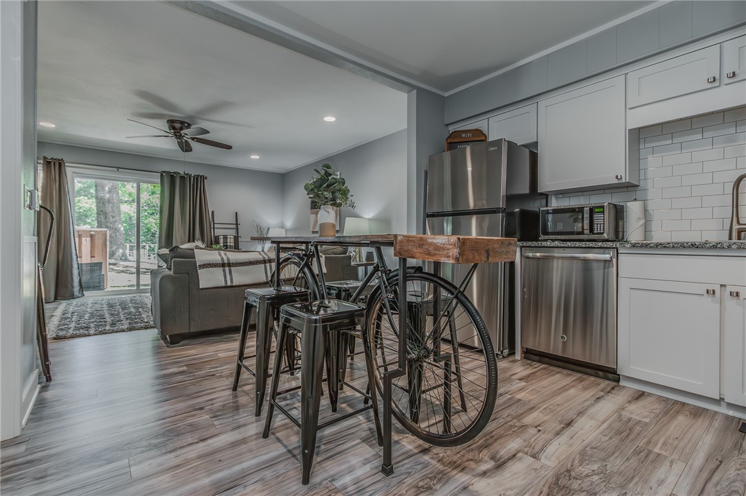 This meticulously remodeled townhouse blends timeless design with modern finishes, offering the perfect balance of comfort, style, and convenience. Move-in ready and ideal as a primary residence, vacation getaway, Airbnb, or investment property, this home is designed for easy living and entertaining. The beautifully updated kitchen flows seamlessly into the living area, creating an open and inviting space for gatherings and everyday life. Featuring three bedrooms and three full bathrooms with walk-in showers, the home also includes a versatile bedroom with a built-in desk or vanity—perfect for remote work or creative space. Located in the highly desirable Bella Vista community, residents enjoy access to six golf courses, seven lakes, tennis and pickleball courts, clubhouses, pools, fitness centers, and miles of scenic walking and biking trails. Furniture is negotiable with an accepted offer.