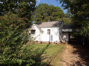 This cute 3 bedroom 2 bath home will be a great place for your family! Wood floors, big laundry room, fenced front and backyard, and big storage building in the back. Call today to take a look!