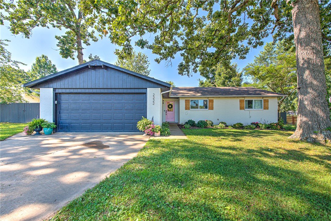 A premier investment opportunity in a high-growth entertainment corridor. This 3-bedroom, 2-bathroom ranch property is positioned for long-term appreciation or short-term rental potential, featuring a rare 0.49-acre lot with agricultural zoning, perfect for a unique urban homestead.
The property is situated just down the road from the new planned professional soccer stadium development, and minutes from the Walmart AMP, Promenade Hills Mall, and the area's top dining and retail districts. The garage is equipped with a certified 6-person FEMA-grade tornado shelter, offering major safety and peace of mind. The expansive lot also includes a giant, fully powered outbuilding currently configured as a workshop and workout space. Inside, the functional layout includes an updated eat-in kitchen, a living area with a fireplace, a bright sunroom, and a private primary suite. A strong asset positioned directly in the path of major commercial growth.