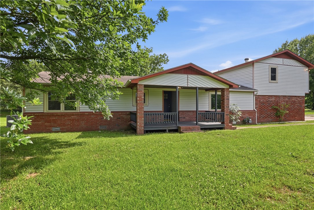 Warm, inviting, and beautifully updated for today’s lifestyle, this property offers over 1,800 square feet of comfortable living space with 4 spacious bedrooms and 3 full baths, all set on 1.12 acres in Russellville. Designed with flexibility in mind, it features two private ensuites—one on the main level and another upstairs—ideal for multi-generational living or added guest privacy. The main level showcases an updated kitchen with sleek new cabinetry, granite countertops, and stylish appliances, opening to a spacious living area, along with three bedrooms, two full baths and a generous laundry room. Upstairs, you’ll find a private retreat complete with an ensuite, walk-in closets, and a versatile bonus space perfect for a home office, hobbies, or additional living area. With modern updates throughout and plenty of room to enjoy both indoors and out, this home offers the perfect blend of comfort, style, space and convenience just minutes from everything Russellville has to offer.