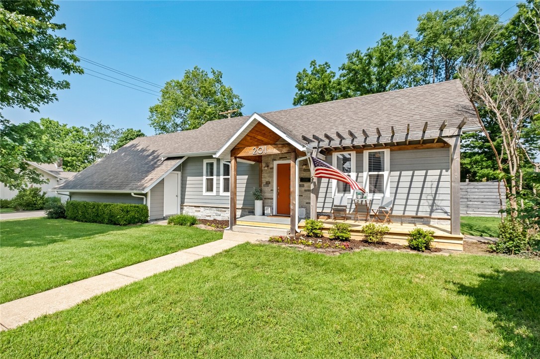 The quaint, convenient and happening lifestyle of Downtown Bentonville is like no other! Just a short stroll from the bustling Bentonville square, this prime property places you at the center of it all. Get to know the community with a weekly farmers market, monthly First Fridays, an array of parks, mountain biking trails, Crystal Bridges art museum, and numerous restaurants and coffee shops—all within walking distance! Ideal for both entertaining and family, the kitchen boasts a gas stove, stainless vent hood, dual sinks, wine fridge, and island seating. A luxurious main bath features a deep soaking tub and walk-in shower. Retreat to a serene main bedroom with his and her walk-in closets and private backyard porch access with a fire pit. There are two spare bedrooms upstairs with a Jack and Jill bath, plus an extra bedroom downstairs.  Don't forget the bonus room with a wet bar, entertainment center, room for games, featuring a Murphy bed. Own a piece of this delightful community - you won't regret it!