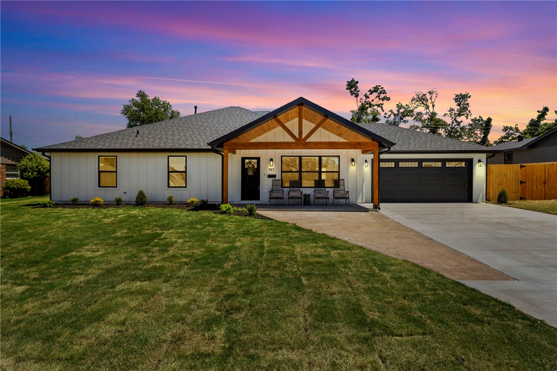 Stunning modern farmhouse blending thoughtful design with elevated finishes throughout. This open-concept home features abundant natural light, wood-look flooring, and a spacious living area flowing into a designer kitchen with an oak and quartz island, soft-close drawers, vented stove and microwave, full-size walk-in pantry, and abundant cabinetry. The private primary suite offers room for a reading nook or journaling space, while the spa-inspired bath features marble tile, dual vanities, soaking tub, and dual shower heads. Oversized primary closet includes lighted storage and exceptional organization space. Secondary bedrooms provide flexibility for guests, office, or hobbies. Additional highlights include extra hall storage, lighted closets, tankless water heater, Hardie plank siding, gutters surrounding the entire home, and a 30-year architectural shingle roof. Enjoy the covered patio and fully fenced backyard perfect for relaxing or entertaining. Move-in ready with timeless style and craftsmanship throughout!!