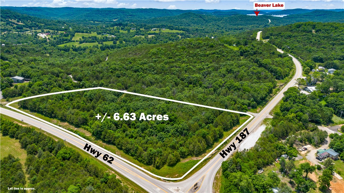 Location, Location, Location! Exceptional commercial development opportunity on +/- 6.6 acres at the highly visible junction of Hwy 62 & Hwy 187, one of the primary gateways to Beaver Lake, White River, and Eureka Springs. Positioned in a high traffic corridor, this property benefits from steady seasonal visitation and excellent exposure to travelers, outdoor enthusiasts, and local residents alike. Located just 5 minutes from Beaver Lake, 3 minutes from White River access, and only 12 minutes from Eureka Springs, the site offers outstanding potential for a wide variety of commercial uses including a restaurant, convenience store, gift shop, winery, boat dealer, outdoor recreation business, or other tourism oriented ventures. With electric service already on site and a strategic location surrounded by popular recreational destinations, this property presents a rare opportunity to establish your business in one of Northwest Arkansas' most visited areas.