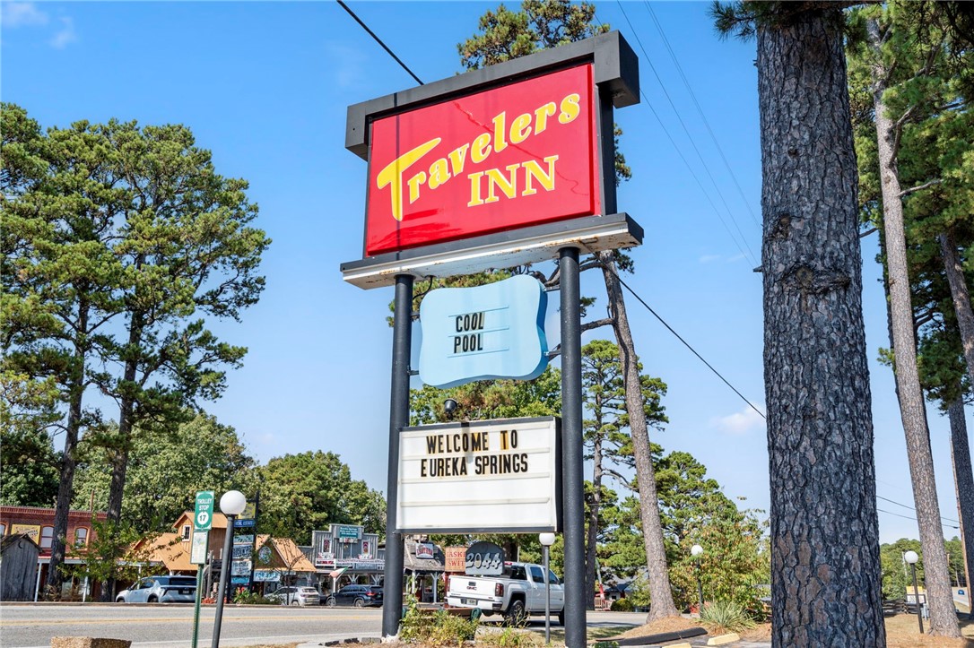 SELLER FINANCING OFFERED – 6.75% interest, 3-year term, 50% down for qualified buyers/operators. This charming 56-room motel in the heart of Eureka Springs sits on +/- 9.7 wooded acres and presents a strong investment opportunity. Over $225K in recent upgrades include new flooring, paint in 44 rooms, bedding, towels, laundry appliances, water heater, and pool plaster. Guest rooms offer private baths, flat-screen TVs, plush beds, and pet-friendly options. Room types include standard kings, single/double queens, and queen suites across four two-story buildings. Amenities include an outdoor pool, sundeck, picnic areas, BBQ grills, and a cozy outdoor fireplace. A renovated 3-bed, 2-bath Airbnb near the entrance (with $14K in updates) provides added income or employee housing. Located just 6 minutes from Downtown and on the Trolley’s Blue Route (Stop #17) for convenient guest access.