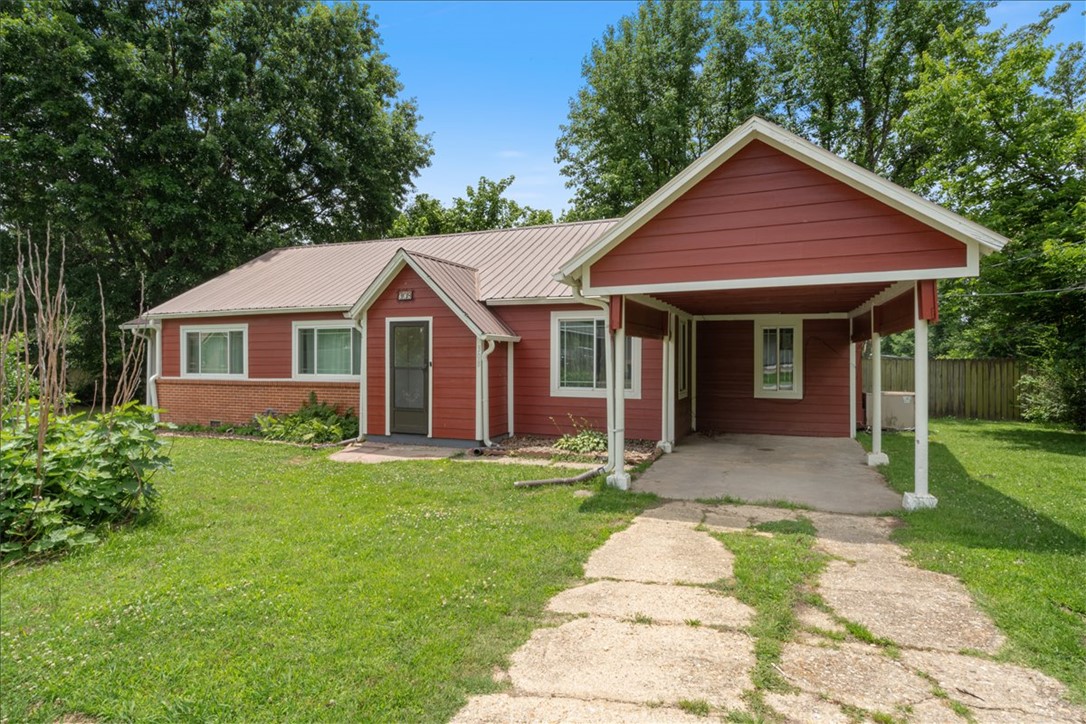 Big updates, great price, and room to make it your own! This 3 bed/1 bath home in Lincoln sits on nearly ½ acre and is packed with meaningful improvements — metal roof with leaf guard gutters, hardy board siding, and a new water heater (2025). The open living and dining area is welcoming and functional, and the kitchen offers plenty of room for cooking and storage. A sliding door off the dining area leads to a covered side porch, and a separate covered patio in the back overlooks a large privacy-fenced yard complete with swing set, jungle gym, and a metal storage shed with wood floor. Large shade trees, an apple tree, and a fig tree add charm and character you just don't find everywhere. Refrigerator, washer, dryer, and gas range all stay. Carport plus plenty of extra parking. While this home offers a great opportunity to add your own finishing touches, you get real value at a price point the fully renovated competition simply can't match. Come see it!