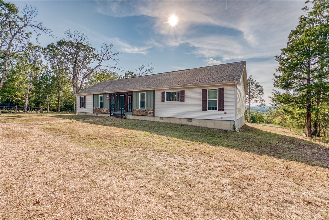 Back on the market at no fault of the property!! GORGEOUS LAKE VIEW! Tucked away at the end of the road is this spacious modern modular home with room for everyone! Nestled on 10 acres, that joins the Corp Line at the bottom, this 4 BR 2 BA home has everything you need to start living your best life at the lake. Once you finish admiring the beautiful views of Bull Shoals Lake from the back deck, step inside to find your gorgeous kitchen with room to cook for the whole family plus their friends, the inviting wood burning fireplace for those chilly winter days and a master closet that is big enough for a whole additional bedroom! Lake properties are getting scarce by the day, don't let this one pass you by.