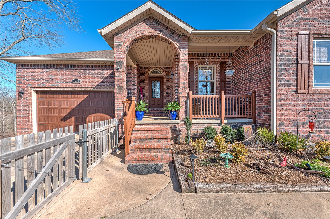 Accessed by just over a mile of well-maintained gravel county road, this beautifully renovated 3,000+ sq ft home offers space, privacy, and lake living on 2.56 acres directly across from Beaver Lake. A tree-lined approach creates a quiet, secluded setting with occasional lake views. Inside, updates include refinished hardwood floors, fresh interior and exterior paint, and updated lighting throughout. The main level features three bedrooms and two full baths, including a fully remodeled primary suite. The kitchen offers new appliances and a functional layout for everyday living and entertaining. The lower level includes a spacious bonus area with a mini kitchen, pool table space, and 75-inch TV, plus a theater room with Polk Audio, full bath, and flex room. LVP flooring for the downstairs has been purchased but not installed. A 30x60 insulated shop with three 12x12 doors, LED lighting, ample electric, and 35 AMP camper hookups adds exceptional versatility.