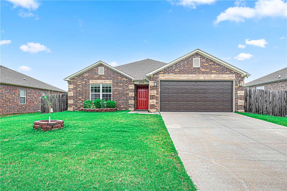 Welcome to 6704 SW Chestnut Hill Ave in Bentonville's desirable Providence Village subdivision! This well-maintained 2020-built traditional home offers 3 bedrooms, 2 bathrooms, and 1,539 sq ft of thoughtfully designed single-level living. The kitchen features Energy Star appliances, a glass cooktop, microwave, dishwasher, and pantry — everything you need for easy everyday living. Solar panels add long-term value and energy savings you'll appreciate from day one. Enjoy the covered patio, professionally landscaped yard, and a handy storage building out back. The attached 2-car garage, double pane windows, and heat pump round out this move-in ready package. Located in Bentonville School District with easy access to shopping, dining, and all that NW Arkansas has to offer.