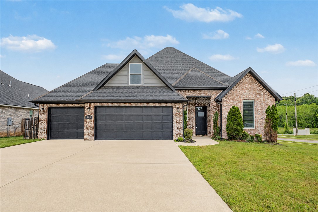 Located in Mill Park Subdivision in Elm Springs, this is the one you've been waiting for! This home sits on a corner lot and offers 4 bedrooms, 2.5 bathrooms.  An office/study with a large closet could be used as a 5th bedroom.  As you walk into the open floorplan the living room opens up with 10 ft ceilings, beautiful wood beams and a gorgeous focal fireplace.  The kitchen has custom inset cabinetry that leads all the way to the ceiling.  An extra island gives the kitchen elegance and provides extra storage and countertop space.   The expansive backyard is a blank canvas to design an outdoor space for all of your outdoor entertaining needs.  This is a prime location in the heart of Northwest Arkansas just minutes away from the new extension of Interstate 612, that when finished, will have you at the regional airport in minutes, or connected to I-49 and 412 West, making it one of the most central locations in Northwest Arkansas.  At this price, it won't last long.  Schedule your showing today.