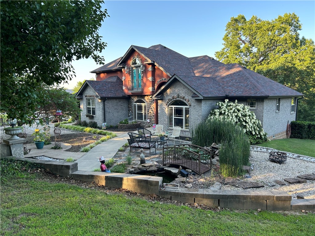 Beautiful 4 acres with Hwy72 frontage. House sets to back of property/privacy. New roof, gutters w/shield, new HVAC & new refurbished decks 2024. Own your own estate w/courtyard gazebo, flowers, large oaks, dogwood & many others. Water flows from pond-pond stocked w/fish. Relax on back deck w morning coffee. Quality construction, custom built w/ wood & ceramic tiled floors in wet areas & carpet in bedrooms. Granite counters thru out. Cabinets galore, deep kitchen farm sink & upgraded fixtures. The living area is center of home w/stunning rock fireplace/insert/wood burning. Opens to eat in kitchen, formal dining room, coffee bar, office & half bath. Primary bedroom w/outside access to back deck. Primary bath has corner whirlpool tub & large walkin shower w/separate his/her sinks. Upstairs is another living area w/bedroom & full bath. Property has a studio apartment (included in HT SQ FT) above 3car garage/workshop. Great for home business/hobby farm. Plenty of parking for RV, boat, 4 wheelers etc... Agent owned