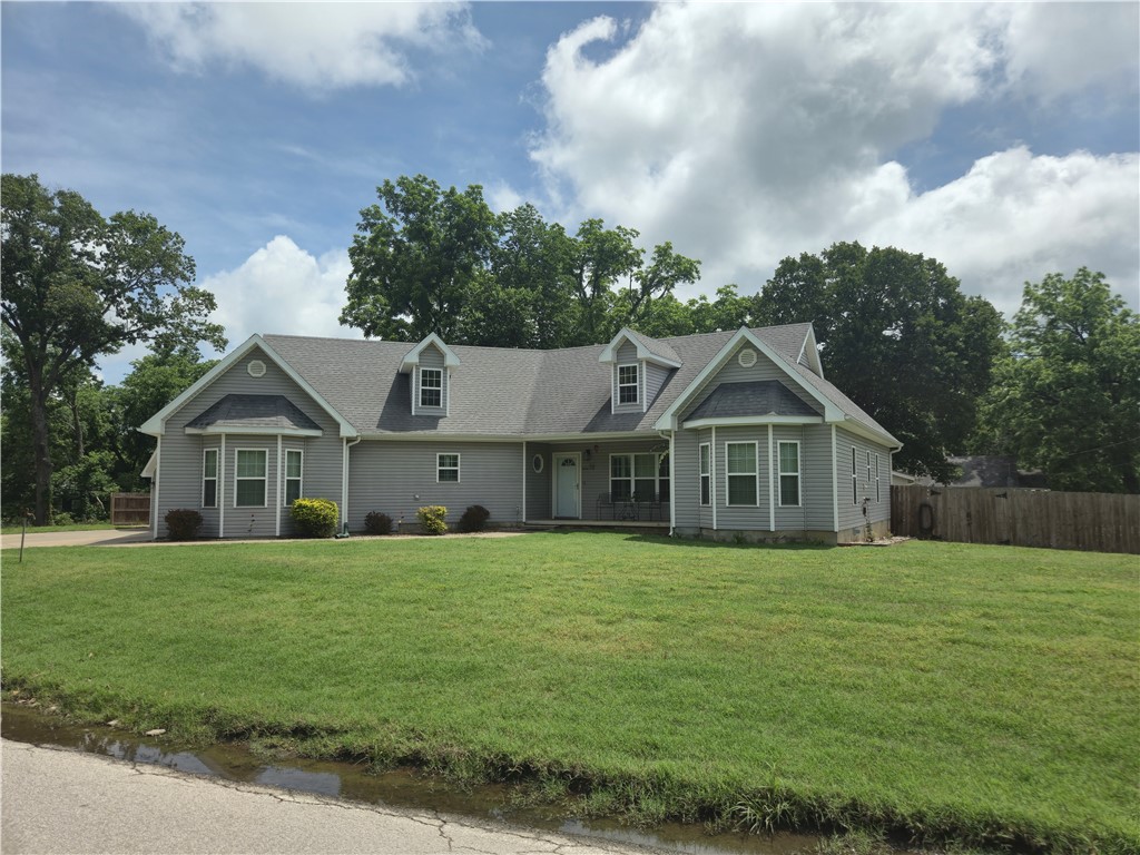 Nice and clean! Custom home east of Rogers with easy work commute. This home is laid out nicely with split floor plan, granite counters, wood flooring, big back deck that is next to the perfect size above ground pool. This 3/2 has open floor plan, great kitchen with huge walk-in pantry, nice dining room with wonderful built-in storage. Updated hall bathroom with barn door. His and hers closets in master suite. Solor tubes to save on electricity and the property has 4 car garage space with addition attic storage above the detached garage. Property offers a circle driveway, privacy fenced back yard, generator ready to kick on during a power outage. HVAC new in 2021. Hot water heater replaced 2020. You can't hardly beat this price for all this home has to offer. This is a must see!