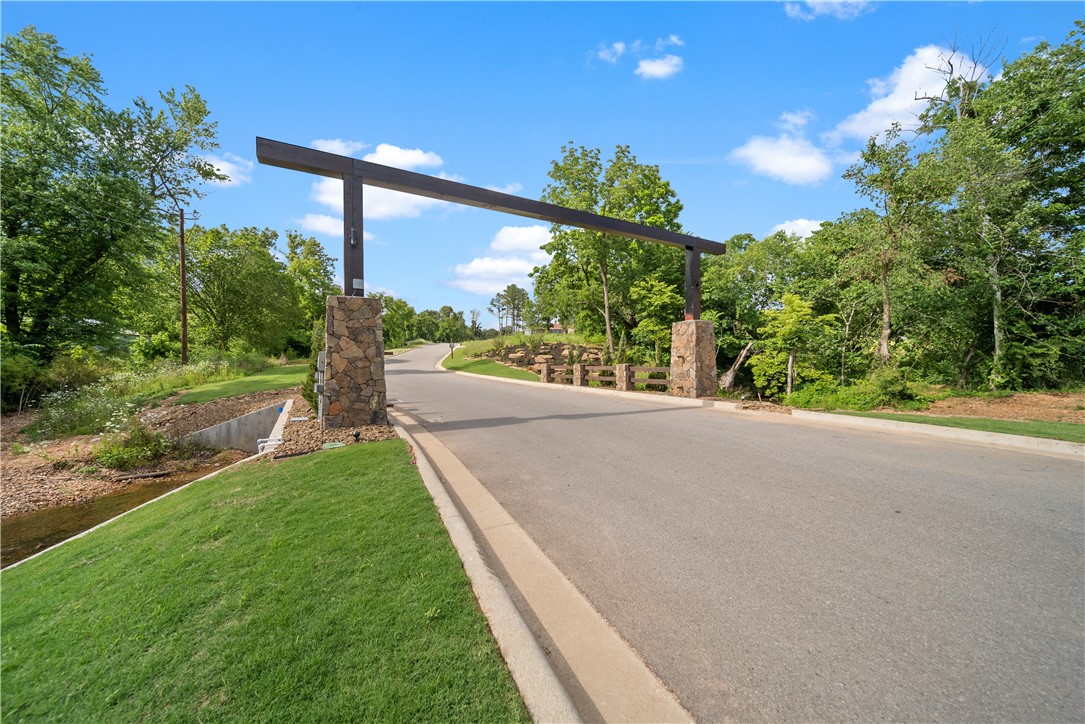 SOLD BEFORE PRINT.  There is absolutely nothing like this neighborhood in all of Northwest Arkansas! Surrounded by natural preserve, gorgeous springs, and the Little Osage Creek, Healing Springs has something for everyone. This fabulous corner lot backs up to the Arkansas Natural Heritage property including the Stillhouse Spring creek so nothing will ever be built behind and you can easily access the creek and the neighborhood amenity space. Public electric, gas, and water. Bentonville schools! Choose your own builder to build your dream home!  Photos are of entire development including common areas.