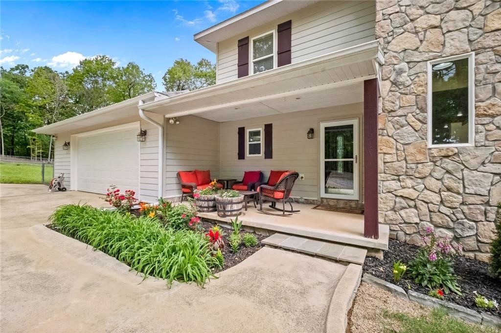 Discover this beautiful 4bed, 4bath home in a peaceful, wooded setting. This multi-level home offers space, functionality, and comfort. Inside, enjoy an open-concept living room and kitchen with a large walk in pantry, perfect for entertaining. The main floor also features a sunroom, a bedroom, full bathroom, and a dedicated home office. Upstairs, enjoy a spacious primary suite with a luxury walk-in closet and private ensuite bath. You'll also find another generously sized bedroom with a walk-in closet, full bath, and
convenient laundry room. The finished basement is perfect for extended guests or hosting events, featuring a second kitchen with pantry, a large recreational room, utility closet, and a bedroom with full bath and walk-in closet. Please take a look at our attached supplements for a full list of in home features. Located just 3.5 miles from Lake Atlanta and 4 miles from Downtown Rogers.