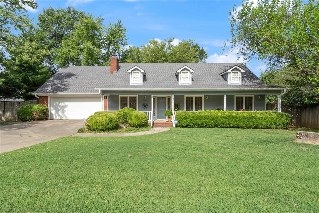 Welcome home to this inviting 3-bedroom, 2-bath residence in a highly desirable location! Relax on the charming full-length front porch, the perfect place to enjoy your morning coffee and watch the sunrise. Inside, you'll find a spacious floor plan with a warm and welcoming living room featuring a cozy brick fireplace. The kitchen offers beautiful oak cabinetry, ample storage, and an island bar ideal for casual dining and entertaining. A private home office just off the dining area provides a quiet space for work or study. Each bedroom is generously sized and filled with natural light, creating comfortable retreats throughout the home. The privacy-fenced backyard is perfect for gatherings, complete with a covered patio for shade and a double gate for easy access to park a boat, camper, or recreational vehicles. Conveniently located near schools, shopping, medical offices, restaurants, and I-49, this home offers comfort, convenience, and everyday charm.