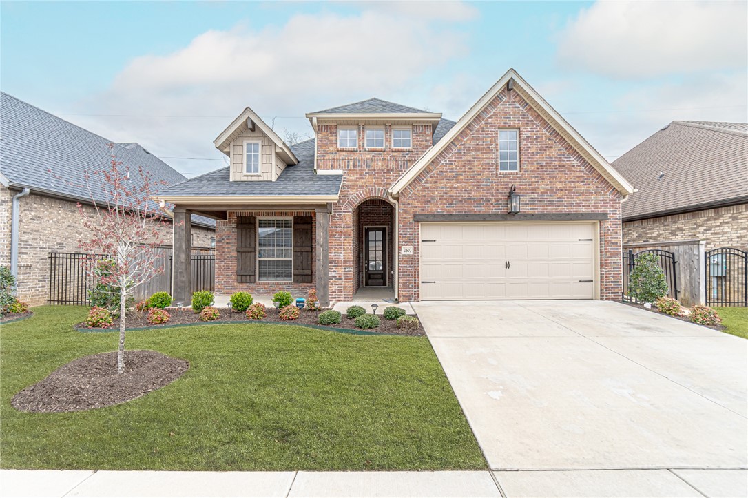 Welcome to this beautifully maintained one-level home in the highly sought-after Brighton Cottages at The Parks in Bentonville. This desirable split floor plan offers an open layout with wood flooring, a gas-log fireplace, abundant windows, and natural light throughout.

The kitchen features granite countertops, an oversized island, walk-in pantry, gas cooktop, built-in oven, and stainless steel appliances. The spacious primary suite includes two large walk-in closets and a luxurious bath with a walk-in shower and separate soaking tub.

Step outside to enjoy the covered patio and fenced backyard with no neighbors directly behind, providing added privacy.

Enjoy low-maintenance living with community amenities including lawn care, pool, dog park, playground, and clubhouse. Conveniently located near the Bentonville Community Center, Willowbrook Elementary, Bright Field Middle School, shopping, dining, and all that Bentonville has to offer.

$3,000 credit for resodding the backyard and carpet.