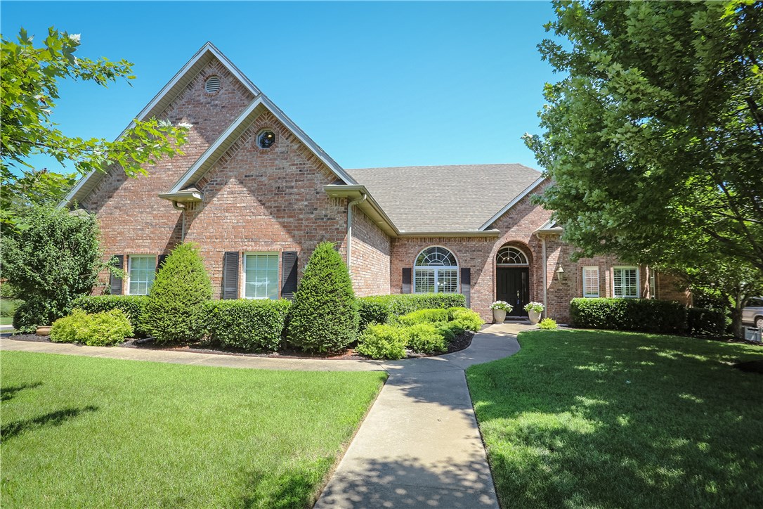 Executive home backs up to woods. Master Suite plus 3 bedrooms with 3 full baths downstairs. Large guest room w/ bath and bonus/media room upstairs. Entertainers dream kitchen with wood floors, wet bar, pantry, double oven and eat-in dining. Hearth room off kitchen w/ fireplace. Living Room adds another FP and natural light from wall of windows. Door leads to enormous covered porch with multi-level deck. Enjoy nature w/ outdoor dining, fire pit or watch TV by the stars. Walk-in attics. Vandergriff Elem.
