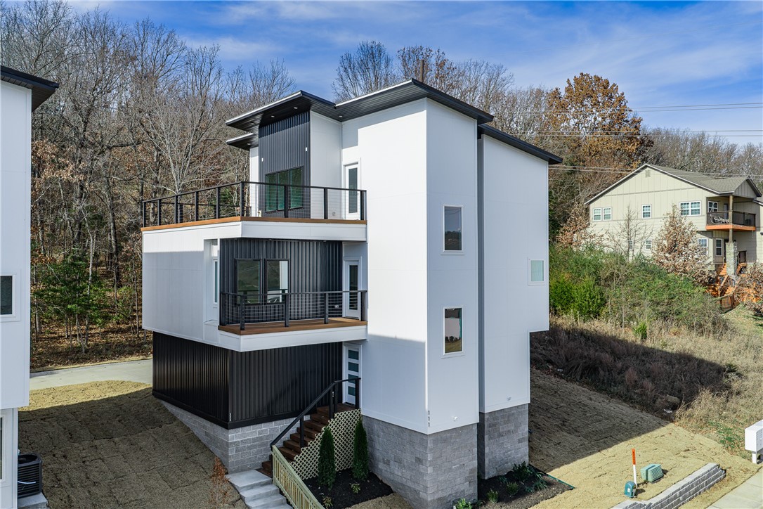 Brand new and perfectly located in South Fayetteville, this home offers easy access to trails, schools, and
more. With rooftop terraces showcasing beautiful views, the home features a gas fireplace, built-in
cabinets in the master suite, and a two-car garage with frosted glass doors. Inside, the open floor plan
highlights hand-scraped hardwood floors, a sleek kitchen with granite countertops, stainless steel
appliances, and a built-in pantry. The master suite is a true retreat with scenic views, a spa-like bathroom,
and a spacious walk-in closet. Guest bedrooms offer plush carpeting, and the home is finished with custom
landscaping and laundry hookups. Builder is offering huge incentives!  Check it out today.