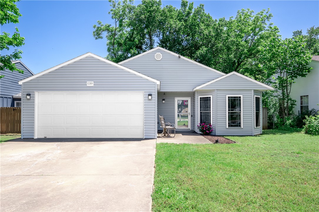 Welcome to 1210 Spring Street, where convenience meets comfort in one of Bentonville's most accessible
locations! This well-loved 3-bedroom, 2-bath home offers 1,255 square feet of thoughtfully designed living
space, perfect for first-time buyers or savvy investors. Situated in the desirable Dogwood Place subdivision
just off exit 88A, you're mere minutes from the new Walmart campus and everything Northwest Arkansas
has to offer. The home has been lovingly maintained with recent updates including a new roof and siding
in 2023, updated flooring in 2024, and a brand-new dishwasher. The kitchen is a standout feature
with Corian counters, tons of storage, and a convenient pantry. Step outside to your private backyard
oasis, complete with mature shade trees and wood privacy fencing—ideal for summer gatherings or quiet
mornings with coffee. With its attached 2-car garage, covered patio, and proximity to biking trails, parks,
and schools, this home is ready for you to write your next chapter!