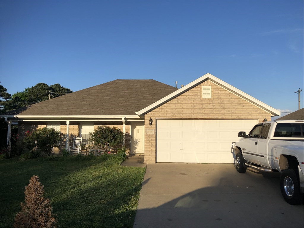 Nice updates and touches to this home. The 3rd room can easily be converted to bedroom. Owner expanded walk in master closet and took out closet in 3rd room. Currently using the 3rd room as a bedroom. Updated wood flooring. Kitchen upgrades. Walk out onto back patio or relax on the front covered porch. Gas fireplace.