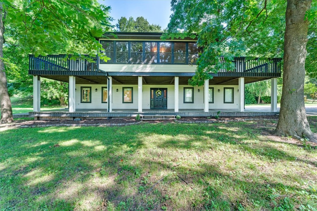 There is room for everyone in this gorgeous 5 bedroom, 3 bath, and 3 car garage home situated on a private cul-de-sac with lovely outdoor spaces to enjoy, providing room to relax and entertain guests.  Two separate living areas offer multiple options for comfort and privacy.  Walk in closets throughout, plus additional ample indoor storage.   Three-car garage has a 9 X 7 workbench area.   Large open kitchen with granite overlooking the beautiful back yard.   Two balconies, a covered outdoor living area, 40 X 20 patio, plus a gorgeous screened-in porch give you multiple options to enjoy the gorgeous surroundings.   All located minutes from I49, Tyson World Headquarters and the Johnson Square right off of Don Tyson.