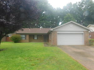 Sit in your sunroom and enjoy your morning coffee! This home offers a covered deck, workshop and fenced backyard!