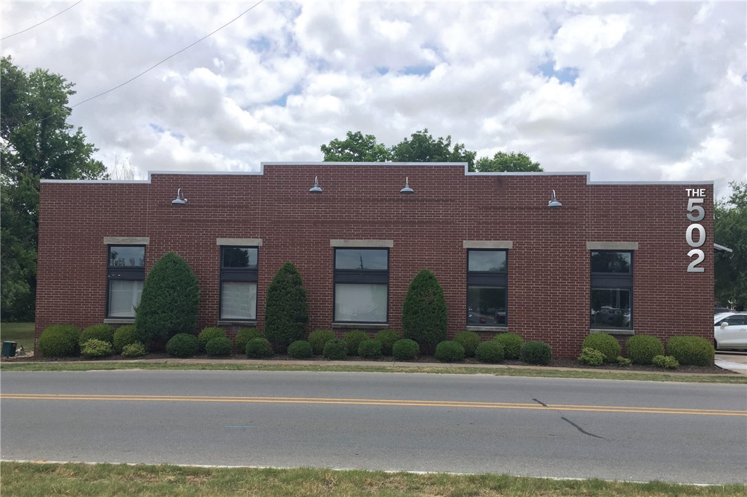 The 502 is located at the crossroads of the vibrant Bentonville Arts and Market Districts.  Converted from single tenant industrial/office to multi tenant Class A office building.  New glass entrance door, painting, flooring and lights in the 409 SW B and new office entrance on SW A St.  All new plumbing, bathrooms, expanded electrical, and upgraded HVAC unit.  New LED lighting systems with substantial long term utility savings.