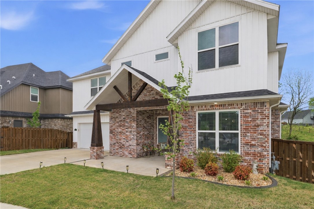 LOCATION!! Welcome to this beautifully crafted two-story home blending modern design with everyday comfort. Offering 3 spacious bedrooms, 2.5 bathrooms, and approximately 2,501 sq ft, this home is perfect for both relaxing and entertaining.
Enjoy exceptional curb appeal with a stylish brick and siding exterior, charming covered front porch with wood beam accents, and a landscaped yard. Inside, the bright open-concept layout is filled with natural light from energy-efficient windows and features seamless flow between living spaces.
Highlights include a fully insulated 2-car garage, extended driveway, private fenced backyard and peaceful green space behind the home. Additional upgrades include a whole-house vacuum system, laundry chute, integrated accent lighting throughout, coffered ceilings and quartz countertops.
Located in a desirable neighborhood near shopping, dining, Coler Mountain Bike Preserve and Bentonville Square. Walking distance to Bentonville schools. Move-in ready and low maintenance!