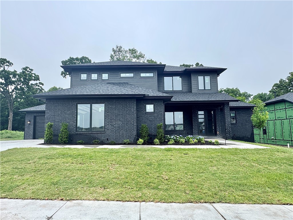 Sought after community of Aurora in the newest phase of Heartbeat. Stunning living room with tiled linear fireplace, custom beams, engineered wood flooring & more. Kitchen features large custom stained island with quartz waterfall counters & backsplash, pot filler, gas cooktop, custom cabinets to the ceiling, double ovens & walk in pantry! Home features a secondary bedroom on the main level and a perfect study with accent wall and chandelier. Primary bedroom with wood floors, painted accent wall & luxurious ensuite bathroom. Primary bath with large vanity, walk-in tile shower with rain shower head & stand alone soaking tub. Upstairs features two large bedrooms & 5th bedroom would also be a perfect bonus room. Huge covered patio with gas fireplace overlooking the backyard with a stunning view of trees! Aurora residents have access to TONS of community amenities. Adult pool, family pool, bike repair station, dog park, elevate fitness course, sports court, open air clubhouse & playground! Internet included in POA!