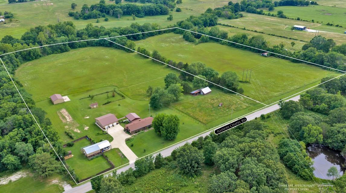 Nice one-owner home on 13.39 clear acres with many outbuildings. 12-kennel dog facility for boarding or training dogs. Two 3-car garages, one with a large party room in the back that could be a studio apartment. The home has 2 living areas and a large room that could be an office, or add a closet and make it a fourth bedroom. Huge covered patio is perfect for large gatherings. 11 acres next door available for a separate price.