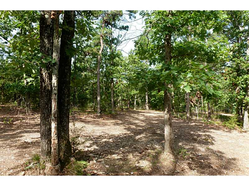 Nice wooded acreage close to Eureka Springs. This land is part of a larger tract, actual price acreage to be determined by a new survey. 4 tracts available from $44,900-$59,000 all with improved drives and level building sites. Plenty of privacy yet close,to town!