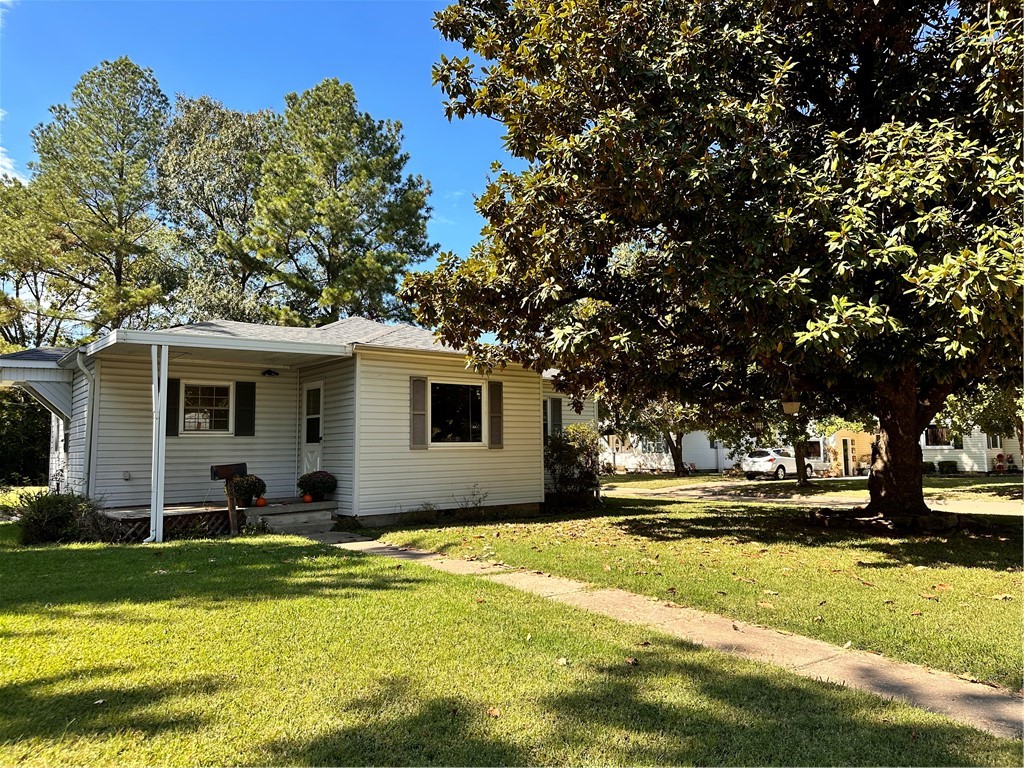 Large corner lot with mature trees. One owner home, built in 1960! Detached shop for extra storage, hobbies, or workshop. Only 1 mile to University of Arkansas Fort Smith, and only 1 hour commute to University of Arkansas Fayetteville and Northwest Arkansas! Three bedrooms, one full bath and one half bath in primary bedroom. Full bath has walk in glass shower recently completed by Re-bath. Refrigerator, washer, and dryer convey with acceptable offer. Showings will begin Friday, October 13, 2023.