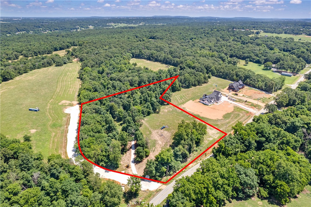 Rare opportunity to own a beautiful 5.75-acre residential lot in Fayetteville. Offering a spacious setting with a blend of privacy and natural surroundings, this property provides an ideal location to build your custom home. Enjoy the peaceful feel of country living while remaining conveniently close to shopping, dining, schools, and everyday amenities in Fayetteville. With ample space for your dream home and outdoor living areas, this exceptional homesite is ready for your vision.