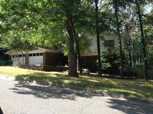 Great 4 bedroom, 2.5 bath home situated on a tree covered lot.  Two living areas one with wood burning fireplace.  Eat in kitchen. Deck and terraced yard.  Privacy fence and play set.