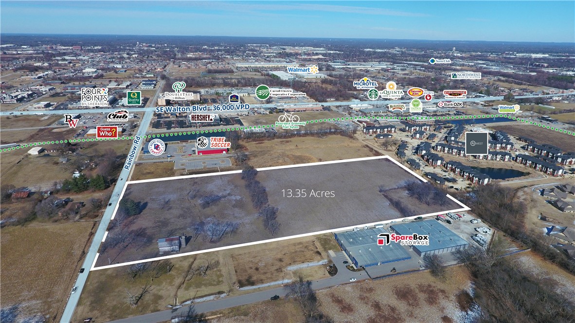 Large tract of land south of bustling SE Walton Blvd with 13.35 acres. Property is near several retailers and convenient to both Rogers and Bentonville amenities with quick access to Interstate 49 and major arterial roads. Potential and best use is for garden-style / mid-rise multifamily project or active adult community.
• +/- 13.35 acres
• Zoned “T5.1,” Town Center Low in Rogers jurisdiction
• Zoning allows for a mix of office, mixed-use, multifmaily and commercial buildings
• 500 feet of frontage on Rainbow Road
• High growth area of Rogers that is immediately adjacent to Bentonville and SE Walton Blvd
• 2.6 miles from t 350-acre Walmart Home Office campus